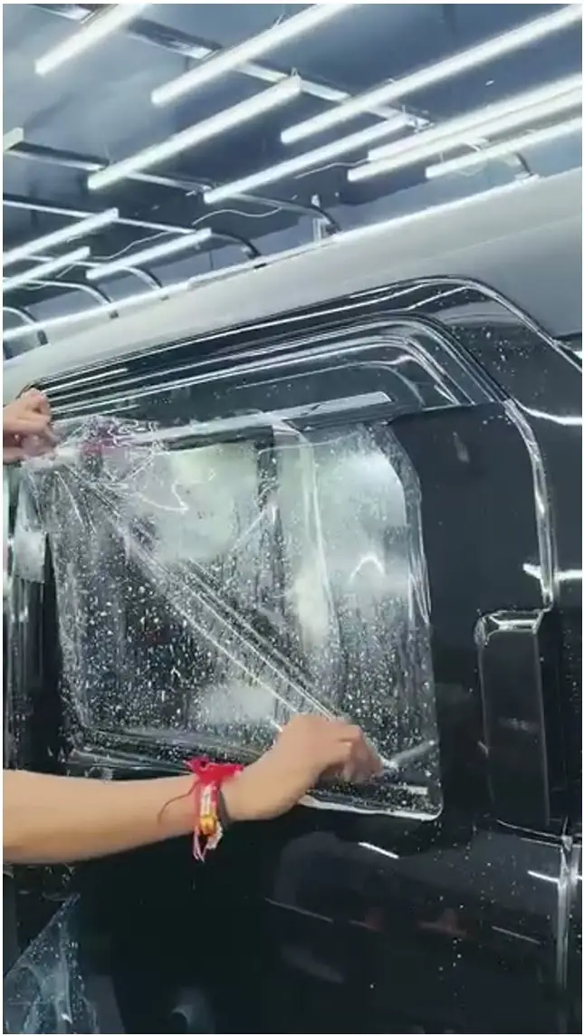 Film worked over the side of a black SUV